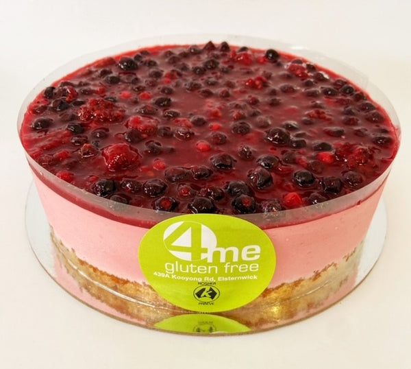 raspberry mousse cake with a mixed berry coulis